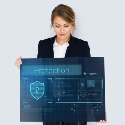woman holding a security compliance sign